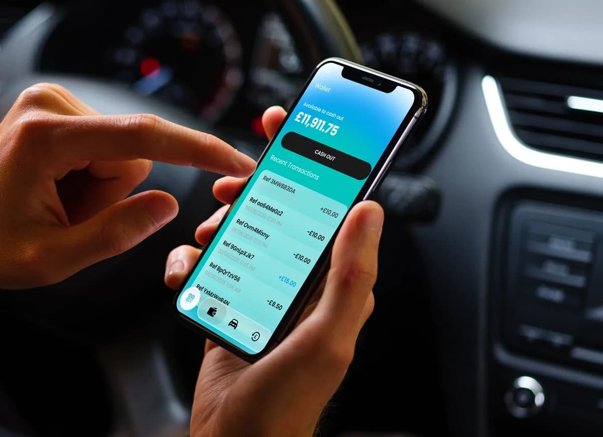 A driver checking their KWallet balance on their phone